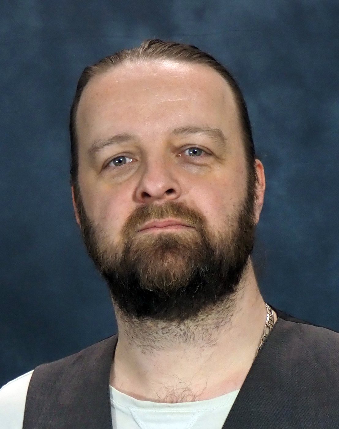 Jay Graham serious, blue backdrop