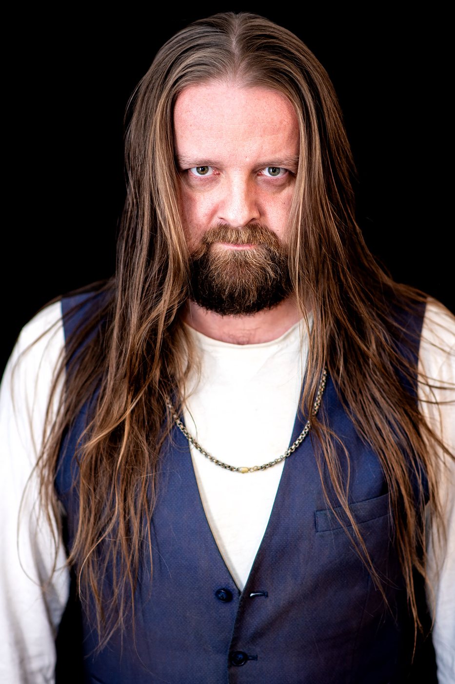 Jay Graham with long hair loose, waistcoat