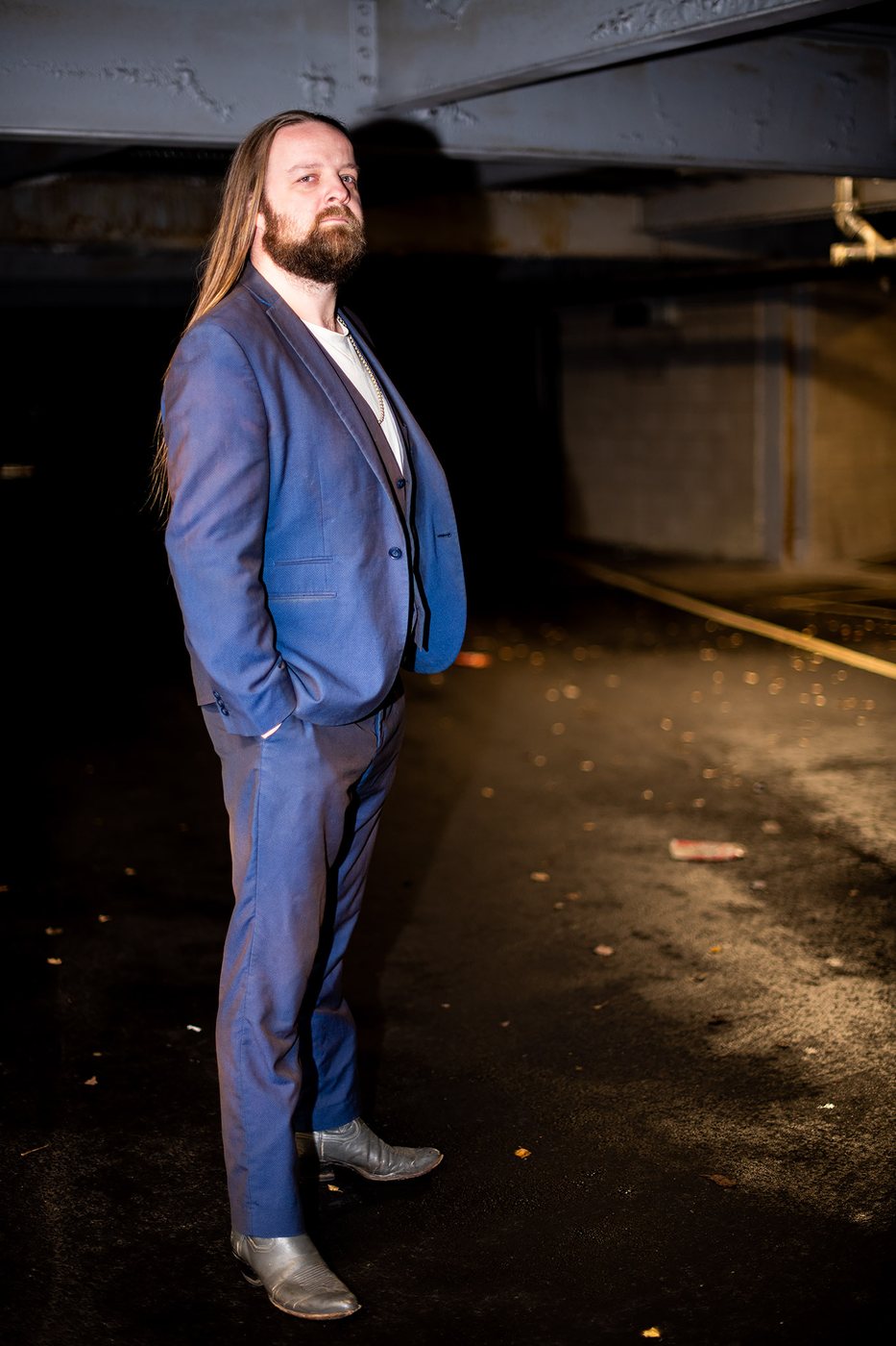 Jay Graham in a blue suit, full length